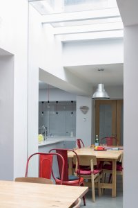 Dining space with wall-length mirror