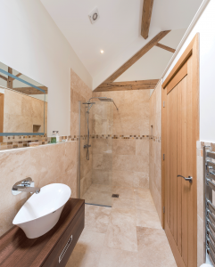 Contemporary bathroom with oak trusses