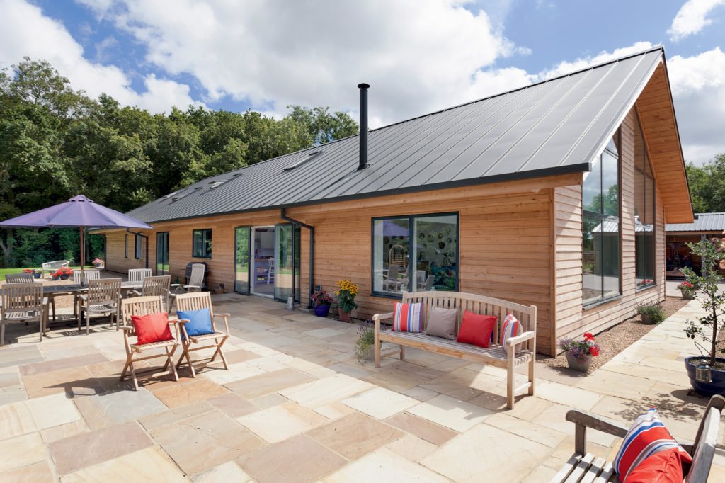 Rear patio of ICF barn-style home