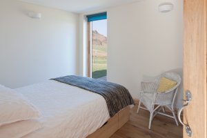 Modern bedroom with sea-facing views