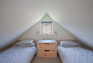 Mezzanine bedroom with pitched roof