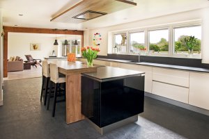 Open-plan kitchen with beamed threshold