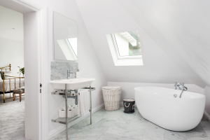 Bathroom with pitched ceiling