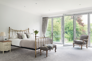 Contemporary bedroom with balcony