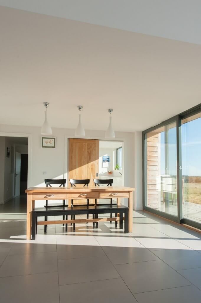 Minimalist dining space with sliding doors