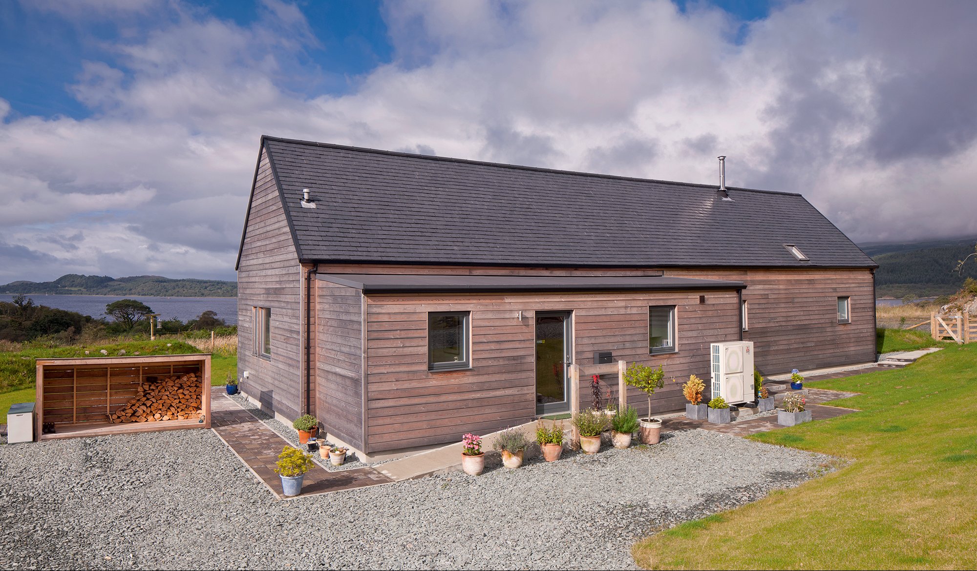 Longhouse self-build with larch cladding