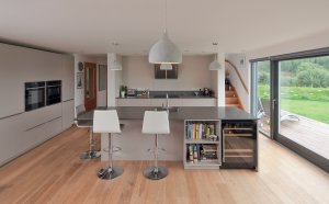 Contemporary kitchen with sliding glazing