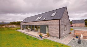 Longhouse self-build with larch cladding