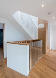 Landing with glass and wood balustrades