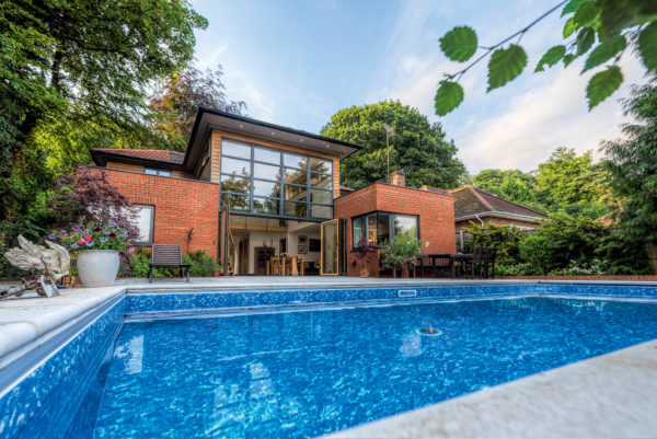 Modern timber frame home with pool