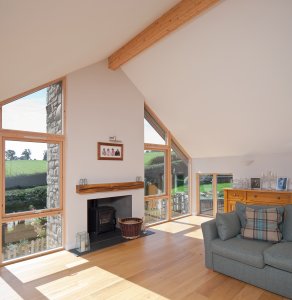 Timber frame self-build home on a sloping plot