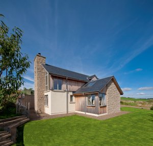 Timber frame self-build home on a sloping plot