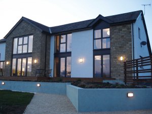 Timber frame Self build clad in stone