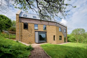 Timber frame self-build on a sloping plot