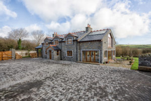 Traditional masonry home with eco features