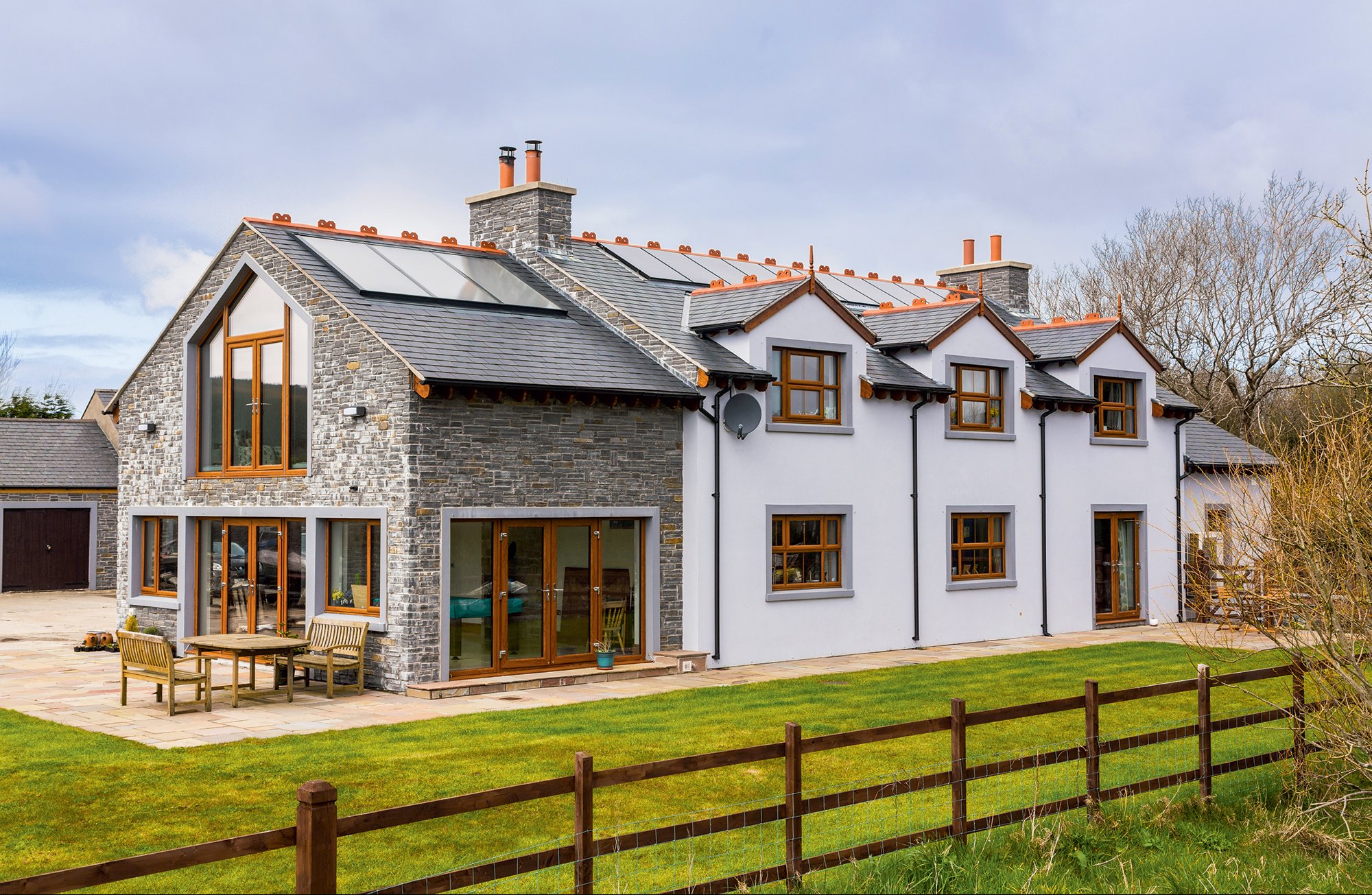 Traditional masonry home with eco features