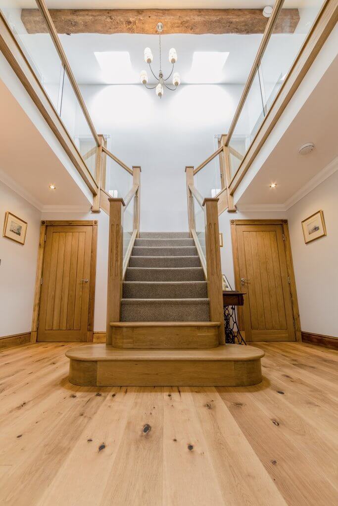 Wood stairs with carpet tread