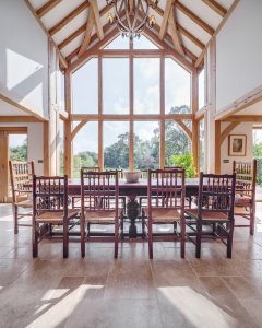 Dining room in oak frame home with glazed gable