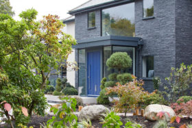 Blue front door in modern home