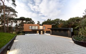 Exterior to modern home clad in timber