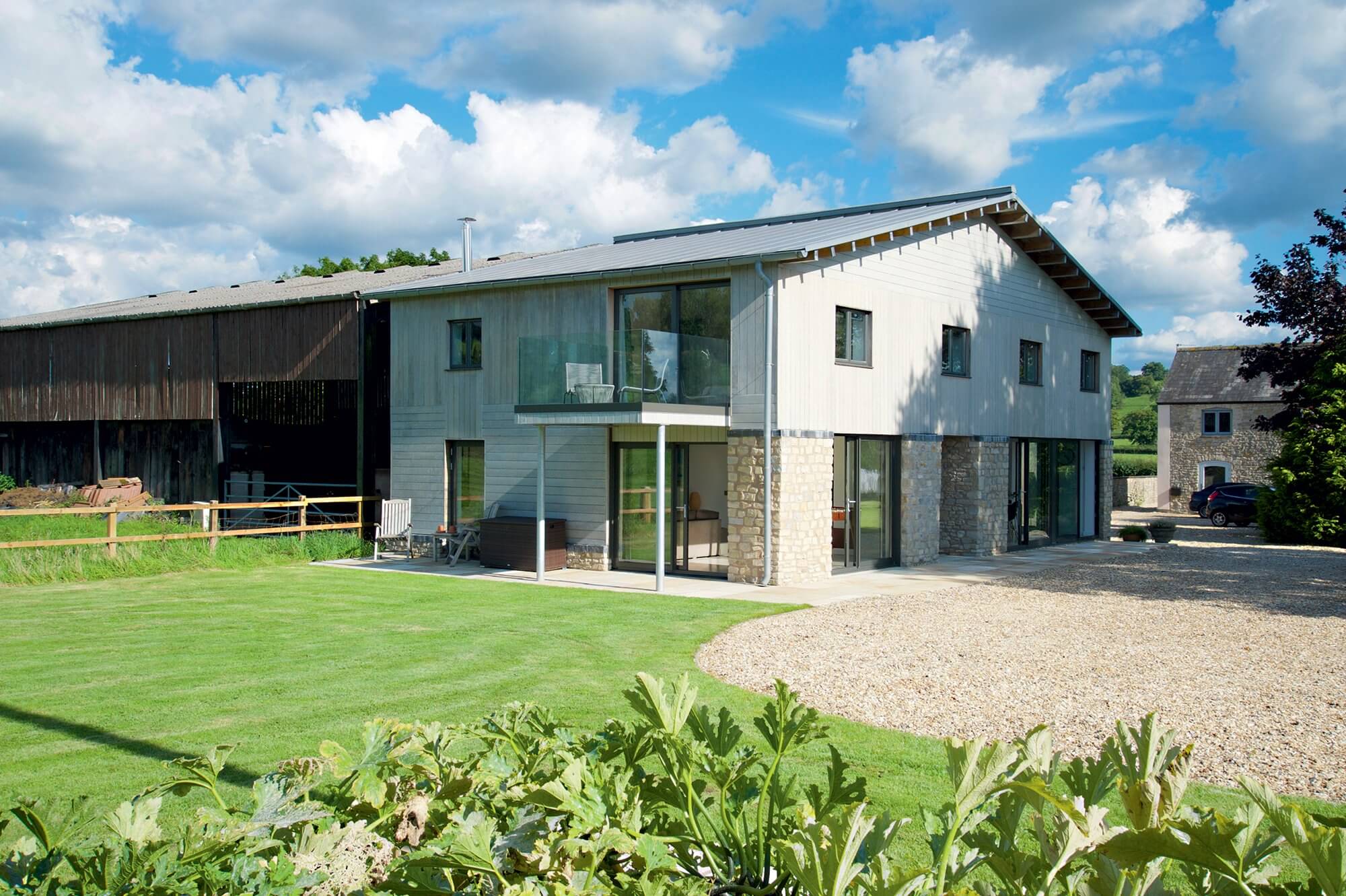 Open-plan barn conversion with zinc roof