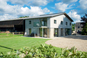 Open-plan barn conversion with zinc roof