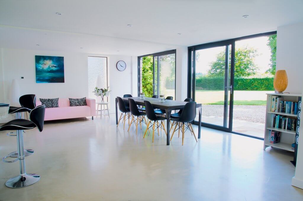 Open-plan barn conversion with zinc roof