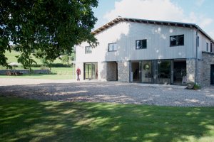 Open-plan barn conversion with zinc roof