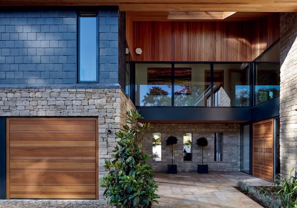 Modern garage door matching entrance and cladding
