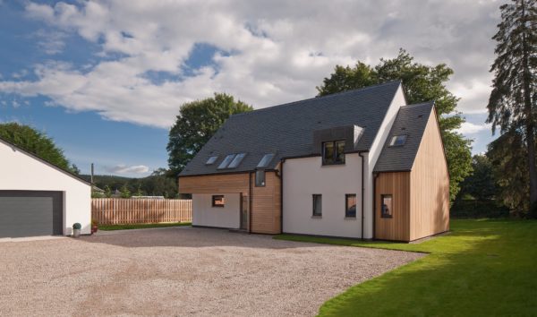 Riverside self-build with wood cladding