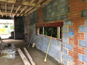 Extension to 1920s house being built before windows are fitted