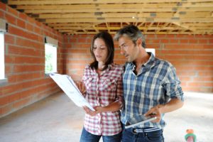 Couple looking at documents in a self build
