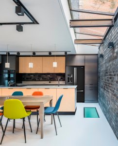 Contemporary kitchen with colourful chairs
