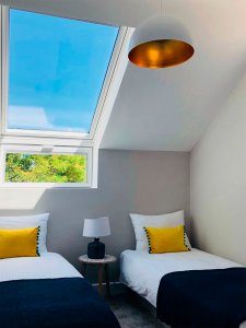 Bedroom with natural light thanks to rooflights