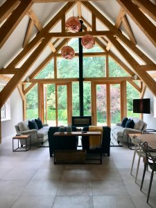 Oak frame extension with lots of glass and a woodburning stove