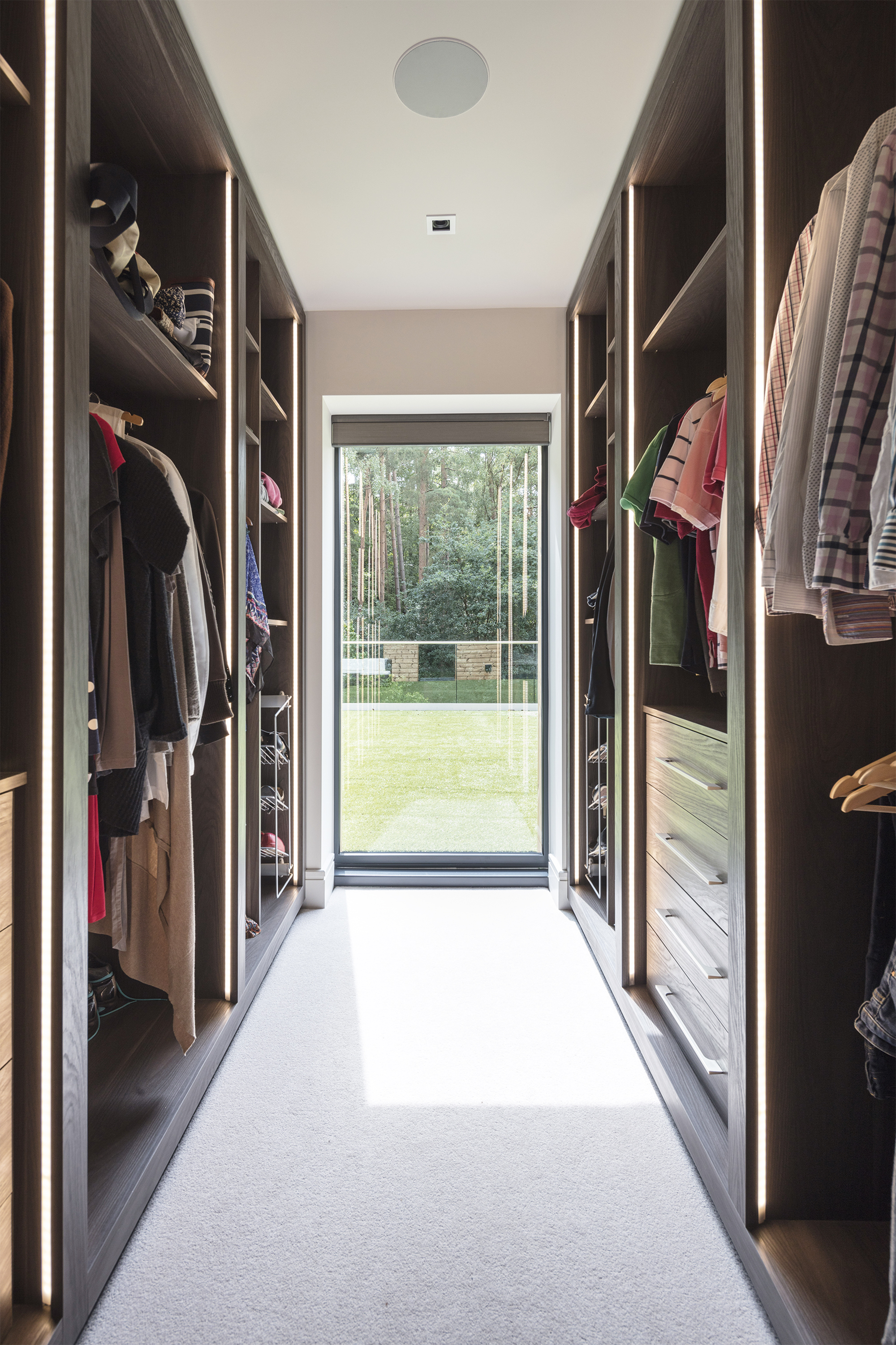 Walk-in closet Bathroom with separate walk-in shower in fully integrated smart home