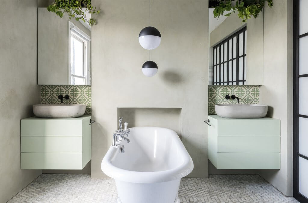 Renovated Victorian terrace bathroom incorporating former chimney as a design feature