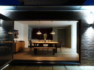 Dining room with modern furniture as seen from outiside the home