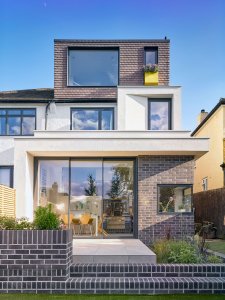 Rear exterior of a renovated London home with ample glazing