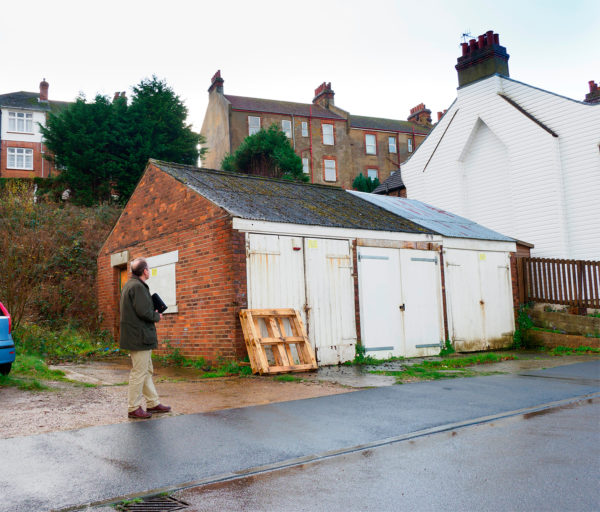 Planning consultant looks at site with garages