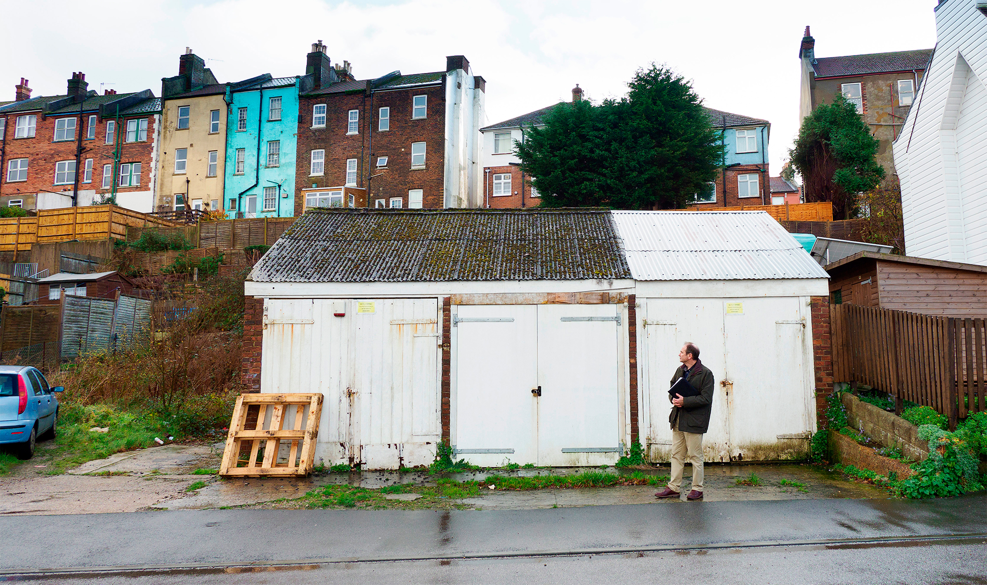 Planning consultant looks at site with garages