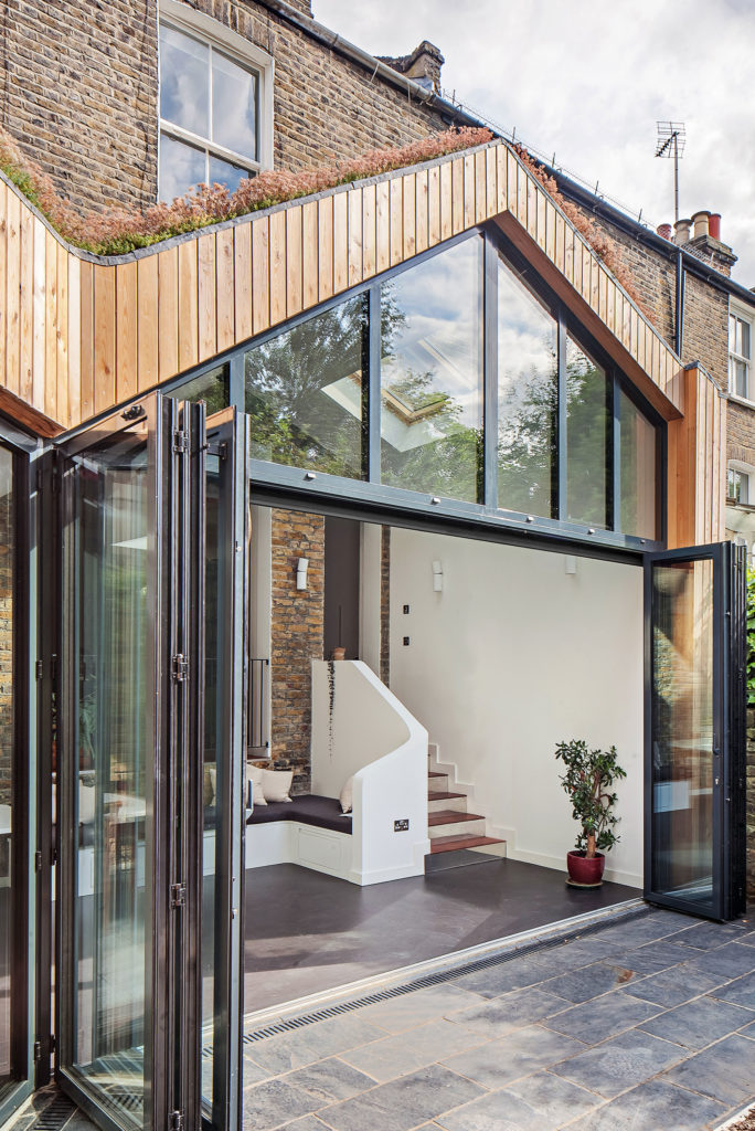 Timber clad extension glazed gable to Victorian terrace