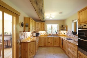 Wooden kitchen in hempcrete house