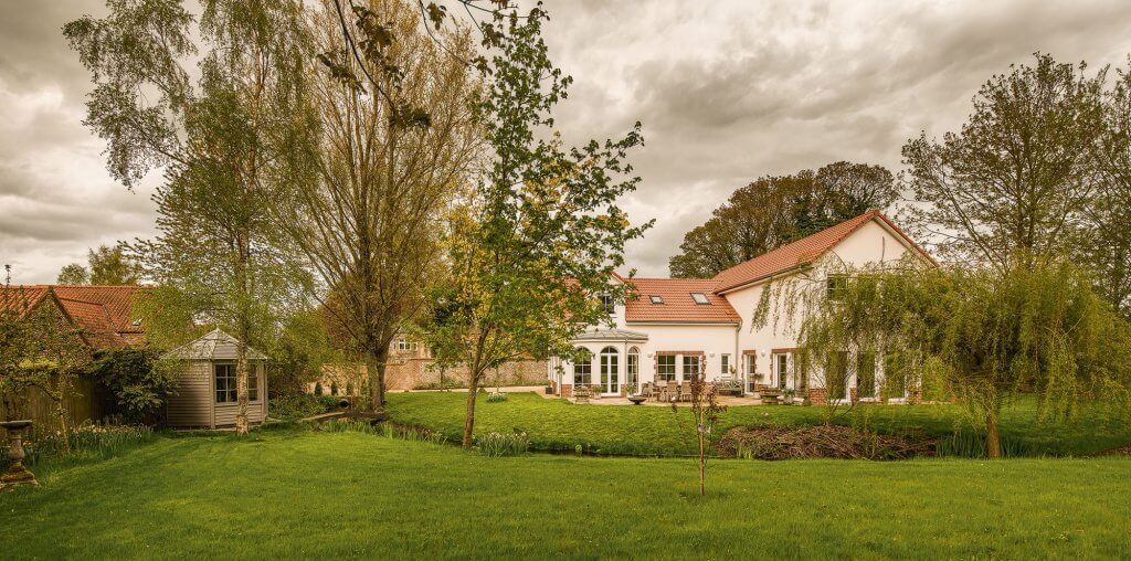 Traditional self build exterior and garden