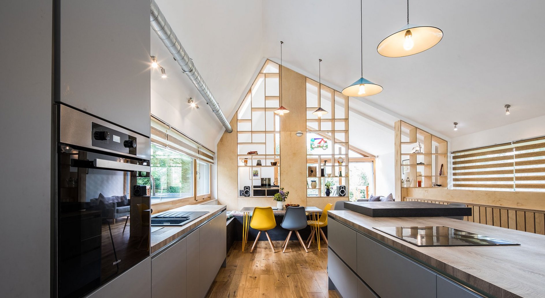 Contemporary kitchen with design furniture in timber frame home