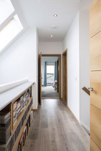 First floor corridor with skylights timber frame home