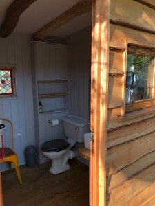 Toilet outside strawbale home