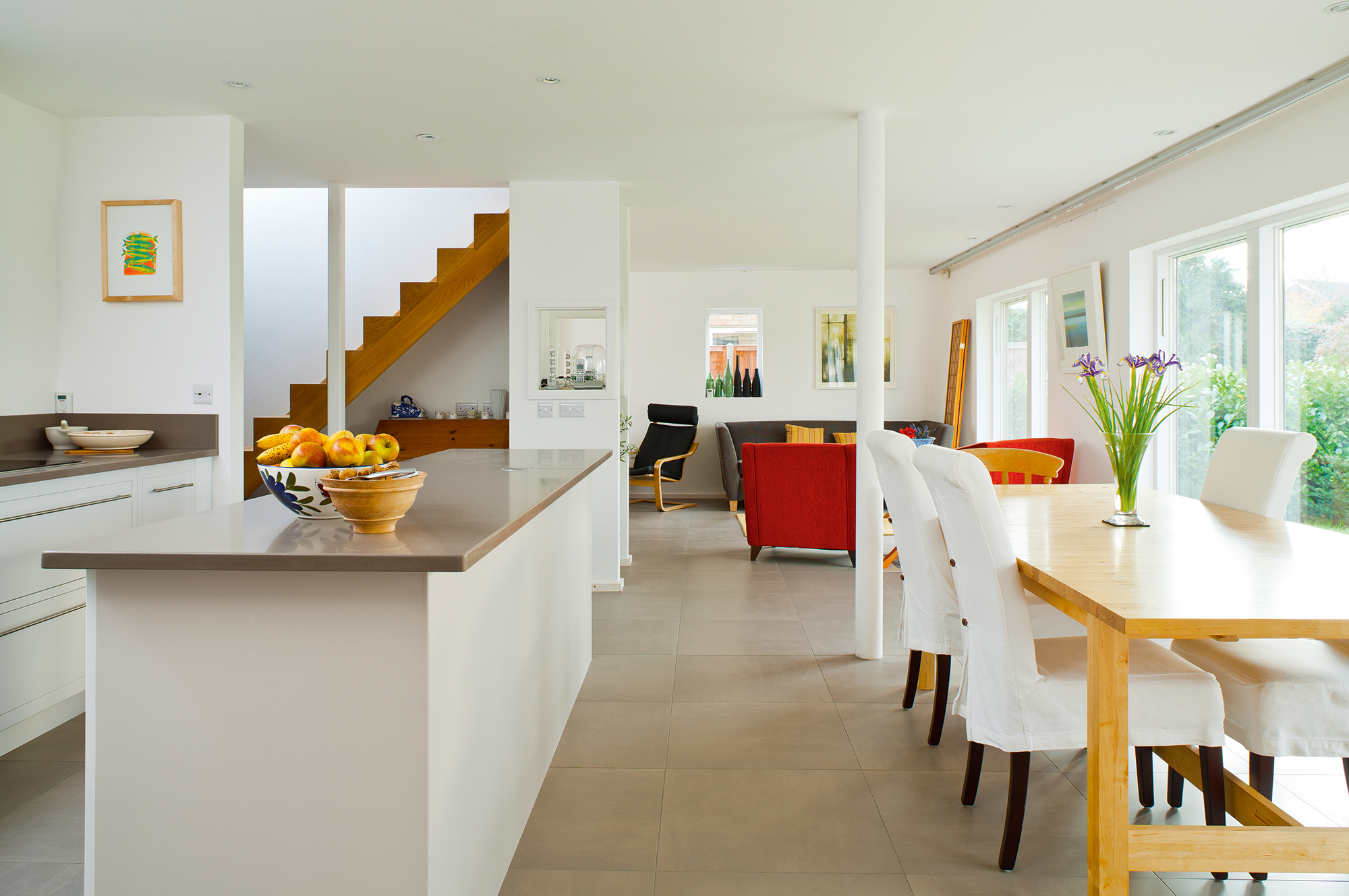 Open plan kitchen-dining-living space in Bungalow renovation by Mole Architects