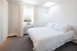 Bedroom with white bed