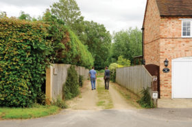 Mike Dade and homeowner looking at the plot